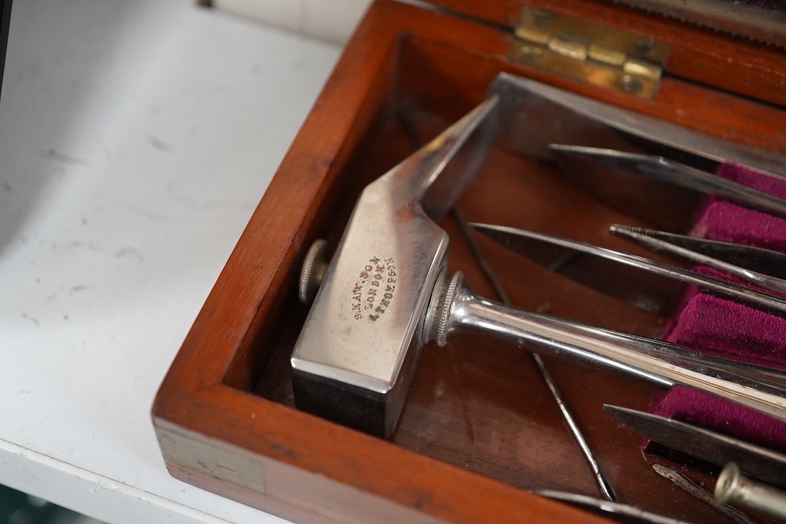 A 19th century mahogany cased surgeon’s set of steel surgical instruments by S. Maw Son & Thompson, London, comprising of an amputation saw, scalpel, a hammer, etc., dimensions of the case; 23.5cm wide, 10.5cm deep, 4cm